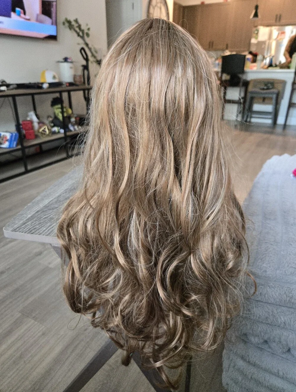 Women's long, wavy synthetic wig in a light brown/honey blonde Light Curls